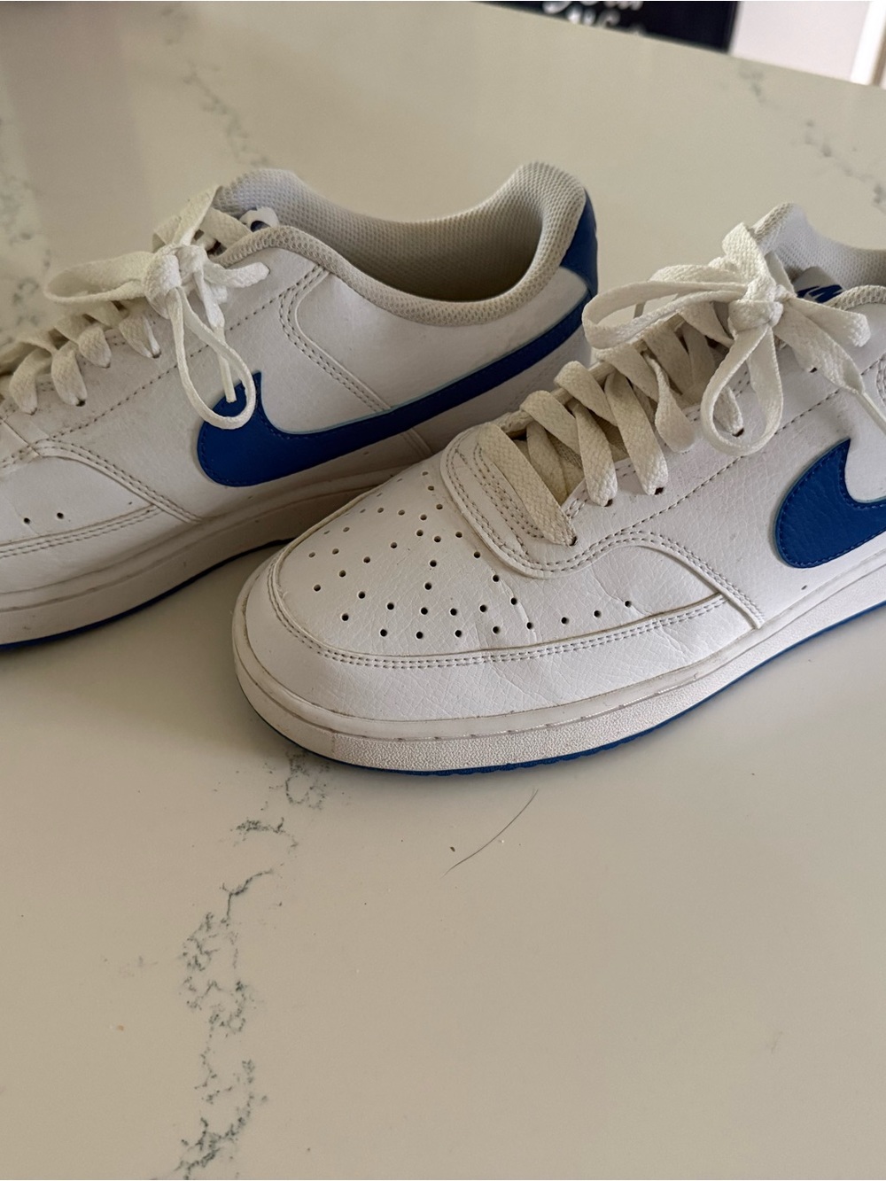 Nike White Sneakers with Blue Swoosh Accent
